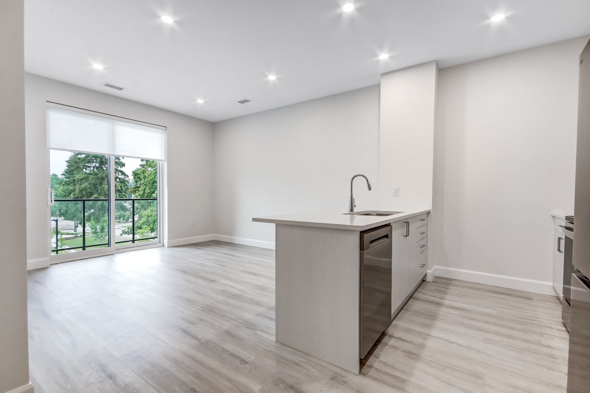 Stanley - Kitchen and Living Area Stanley kitchen island and open living area with a private balcony at Walnut Park